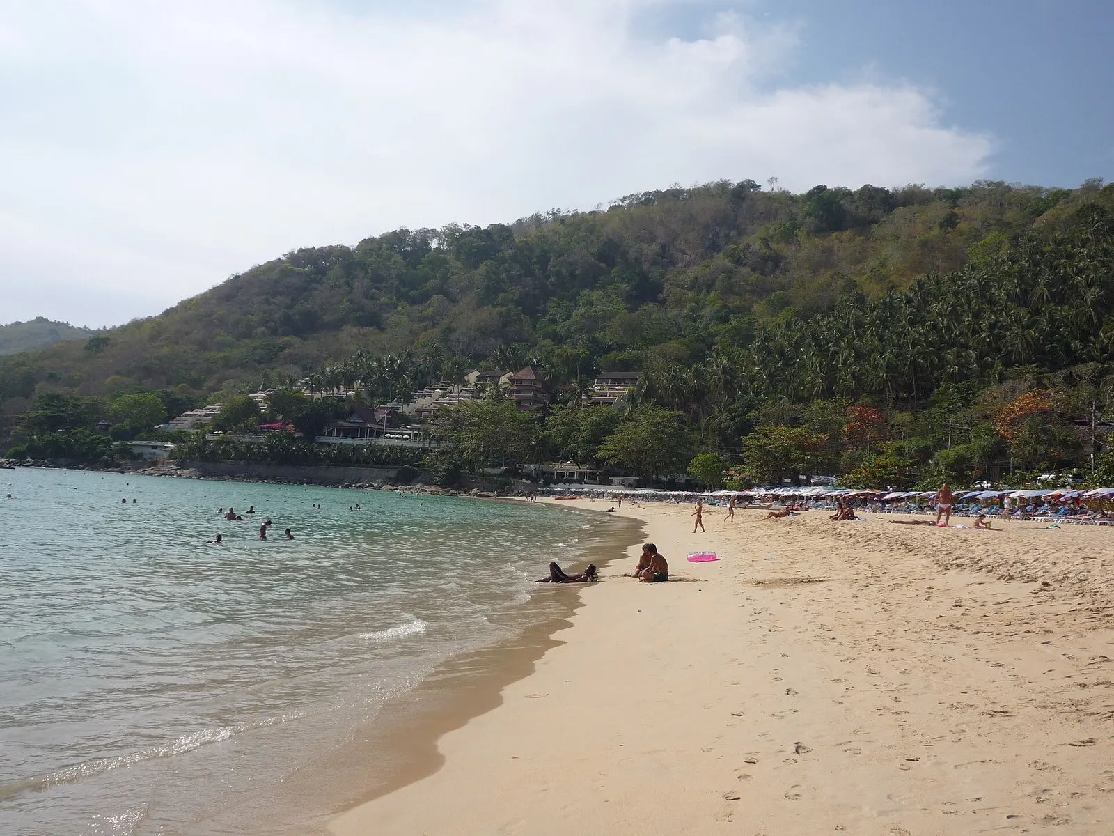 Nai Harn Beach: a crescent of sand under a jungle headland, calm water