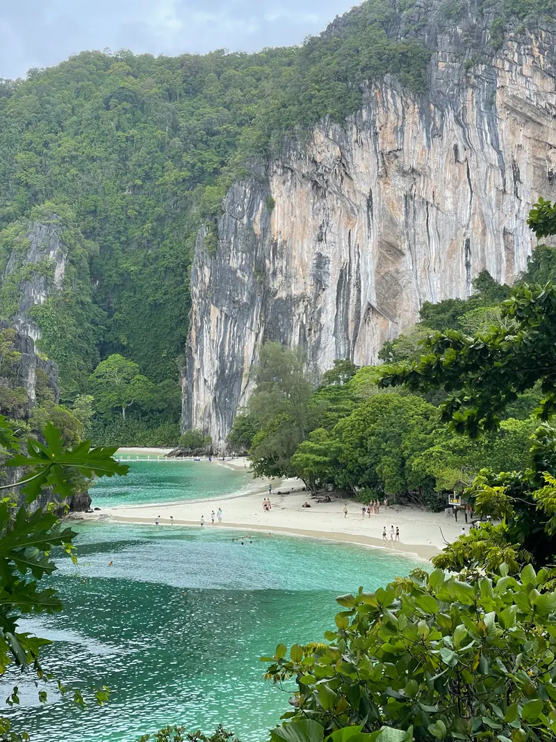 A limestone cliff and a small beach in a cove of Phang Nga Bay, off Koh Yao Noi