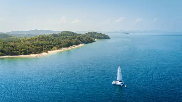Lagoon 56 OO7 — aerial view off an island